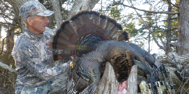 Eddie Claypool with a bow-killed turkey on public land